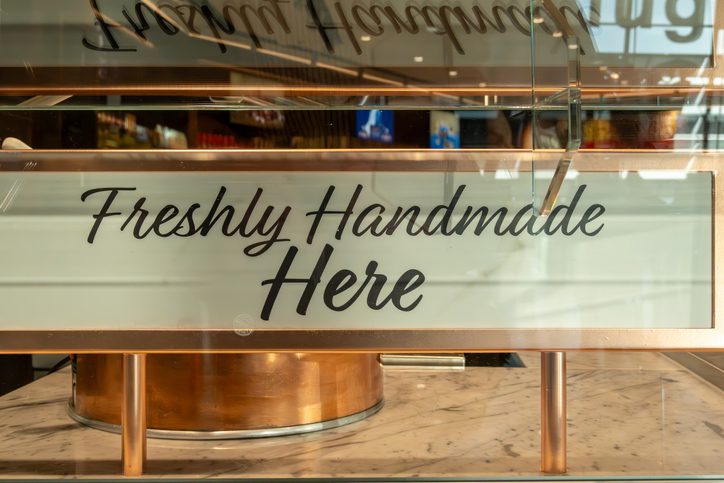 Business signage installed on a shop front attracting customer attention